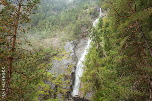 waterfall among the misty forest in Italy