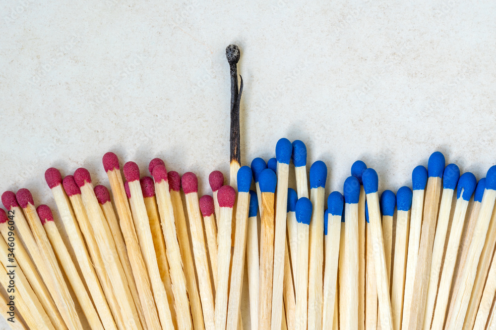 One burnt match among many new whole One burnt match among many new whole