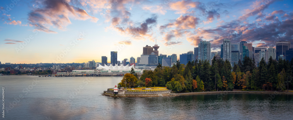 Naklejka premium Vancouver, British Columbia, Canada. Beautiful Panoramic View of Modern Downtown City, Stanley Park and Coal Harbour. Colorful Sunrise Sky Composite. Cityscape Panorama