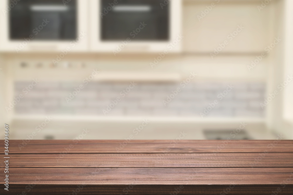 Obraz premium Wood desk space and blurred of kitchen background. for product display montage. business presentation.