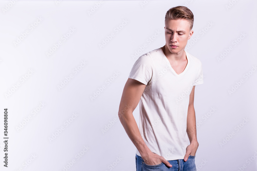 Sexy smiling male model against white background Sexy smiling male model against white background