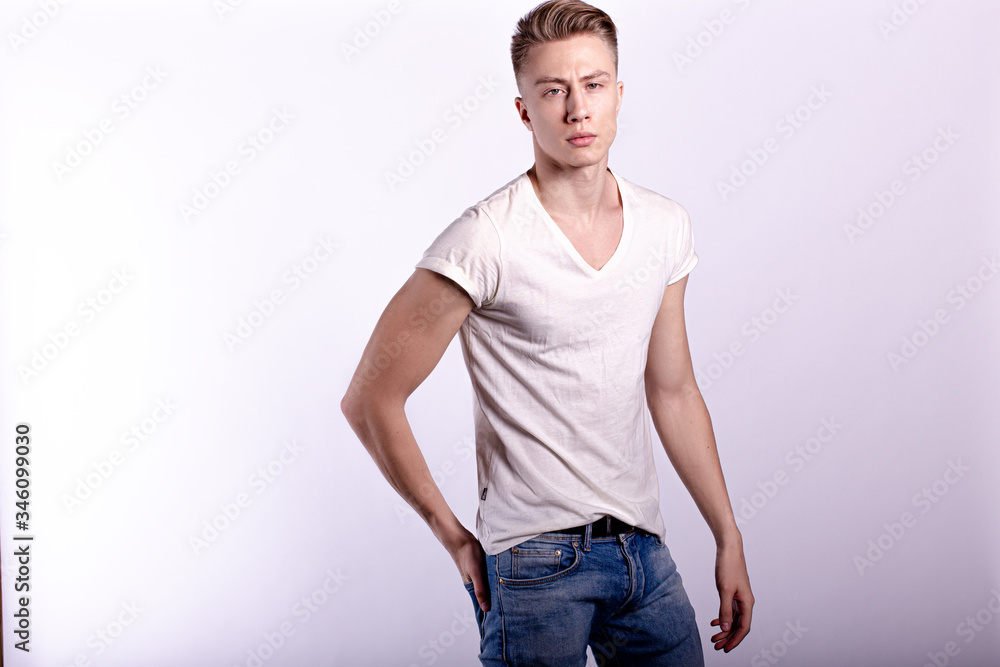 Sexy smiling male model against white background Sexy smiling male model against white background