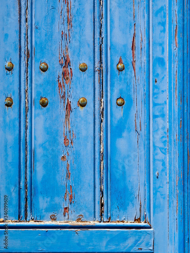 Blue wooden texture. Old wooden door on Santorini island. Cyclades, Greece.