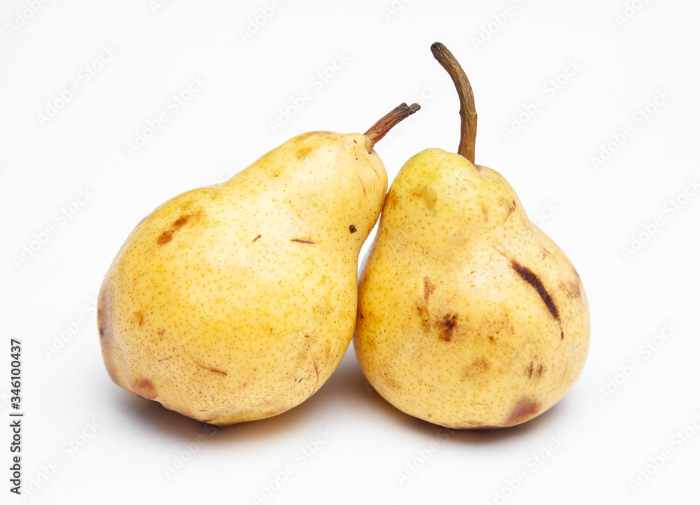 two yellow ripe pears on a white background two yellow ripe pears on a white background