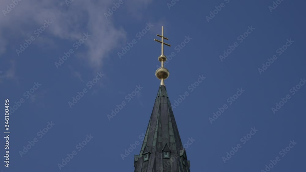 catholic church tower in front of clouds
catholic church tower in front of clouds