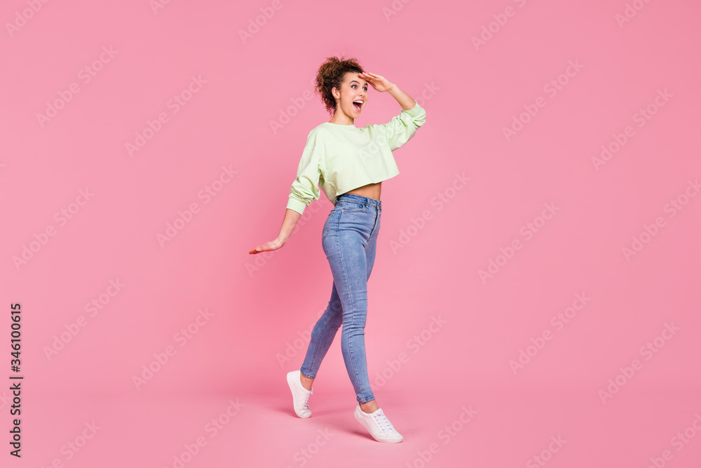 Full size profile side photo of astonished positive crazy girl go walk copyspace hold hand see incredible black friday sales impressed wear sweater jumper isolated pastel color background Full size profile side photo of astonished positive crazy girl go walk copyspace hold hand see incredible black friday sales impressed wear sweater jumper isolated pastel color background