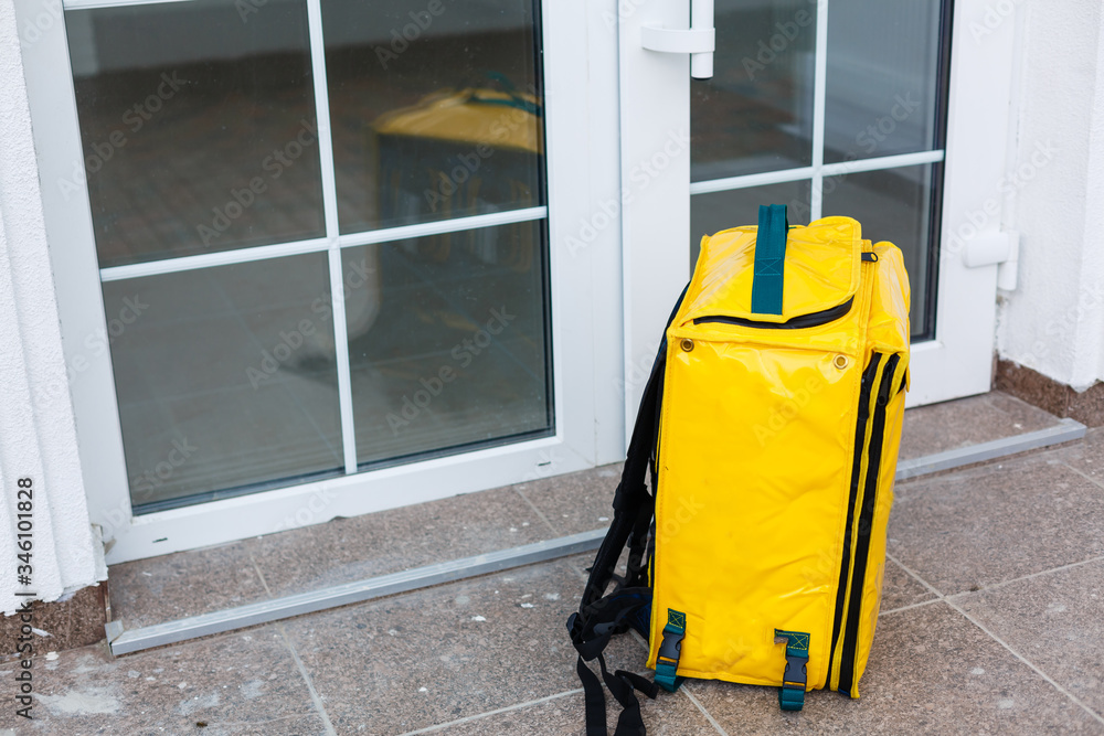 delivery thermo backpack near the entrance to the house delivery thermo backpack near the entrance to the house