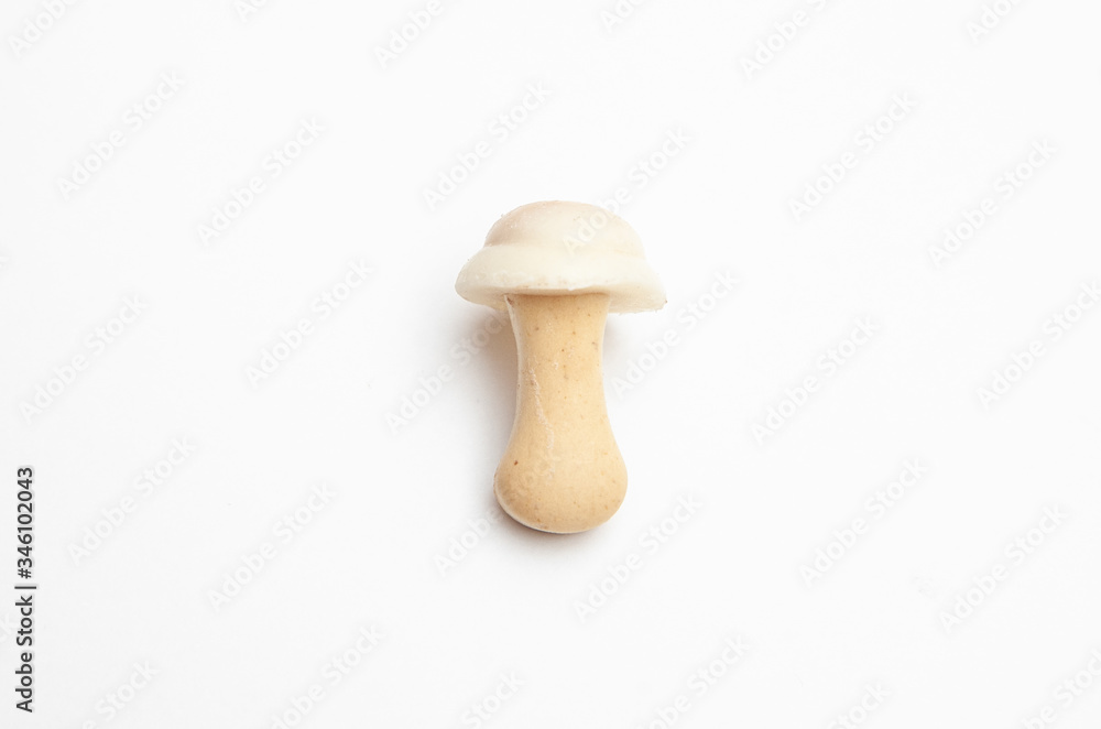 cookies and chocolate in the shape of mushrooms on a white background cookies and chocolate in the shape of mushrooms on a white background
