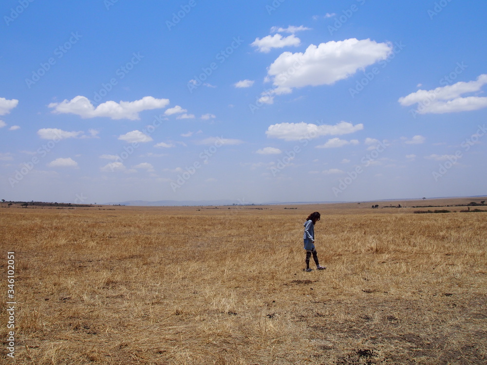 A woman walking in the great outdoors, Safari, Game Drive, Maasai Mara, Kenya