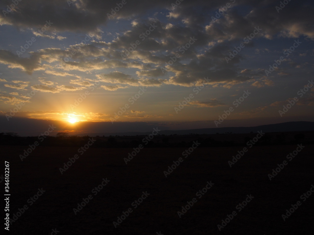 A beautiful sunset in the middle of nature, Safari, Game Drive, Maasai Mara, Kenya A beautiful sunset in the middle of nature, Safari, Game Drive, Maasai Mara, Kenya