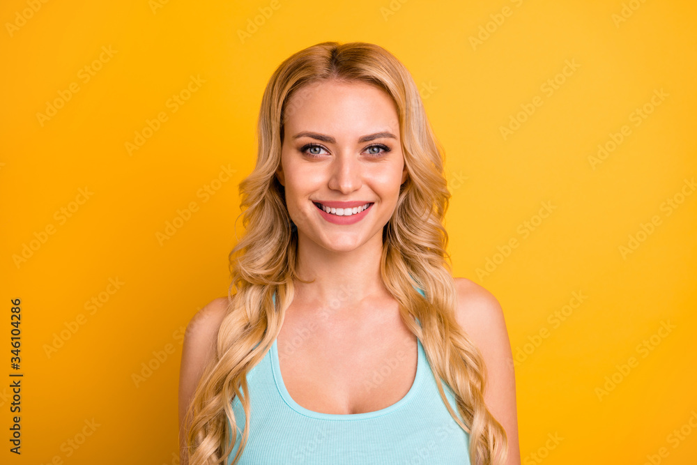 Closeup photo of attractive pretty amazing lady long curly hairdo white toothy smile good mood wear casual turquoise singlet isolated vivid shine yellow color background Closeup photo of attractive pretty amazing lady long curly hairdo white toothy smile good mood wear casual turquoise singlet isolated vivid shine yellow color background