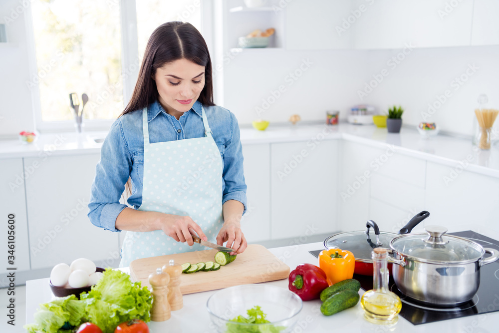 Portrait of her she nice attractive lovely focused brunet girl making cooking fresh tasty yummy salad immunity care culinary hobby in modern light white interior kitchen house stay home