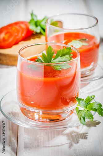 tomato juice and fresh tomato on wooden background