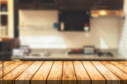 Wood desk space and blurred of kitchen background. for product display montage. business presentation. © qOppi