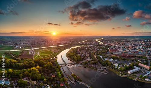 Fototapeta Naklejka Na Ścianę i Meble -  Opole, aerial view of Old Town and Oder river. Poland, spring day. Drone shot on sunset time.