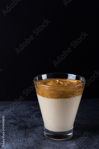 Dalgon coffee in a glass against a dark background. photo