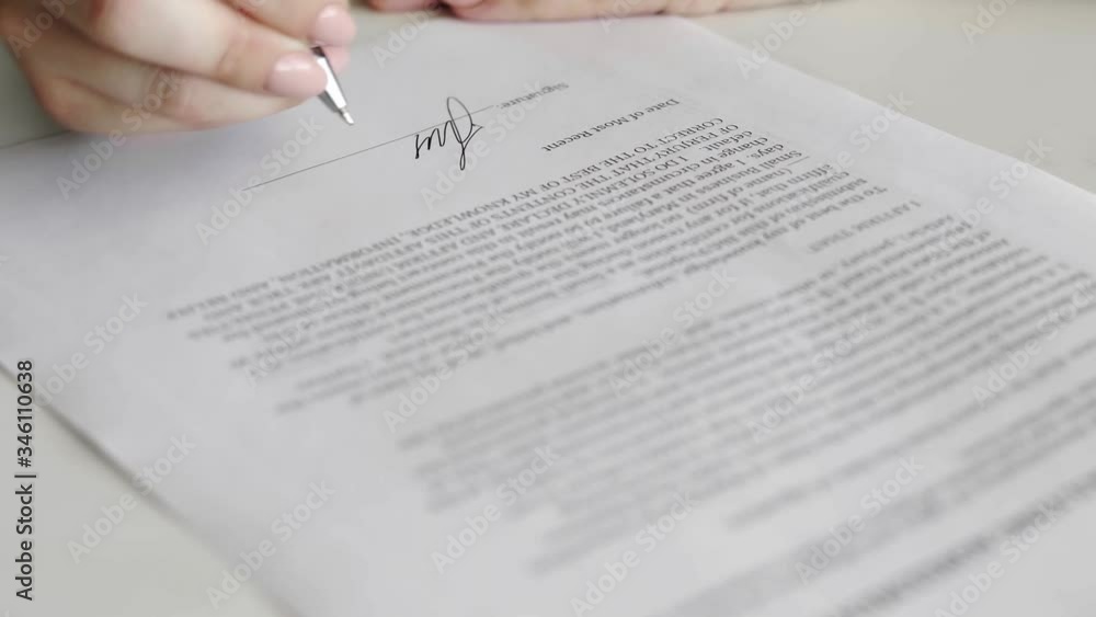 Businesswoman is signing consulting agreement. Person heand signs the document Businesswoman is signing consulting agreement. Person heand signs the document