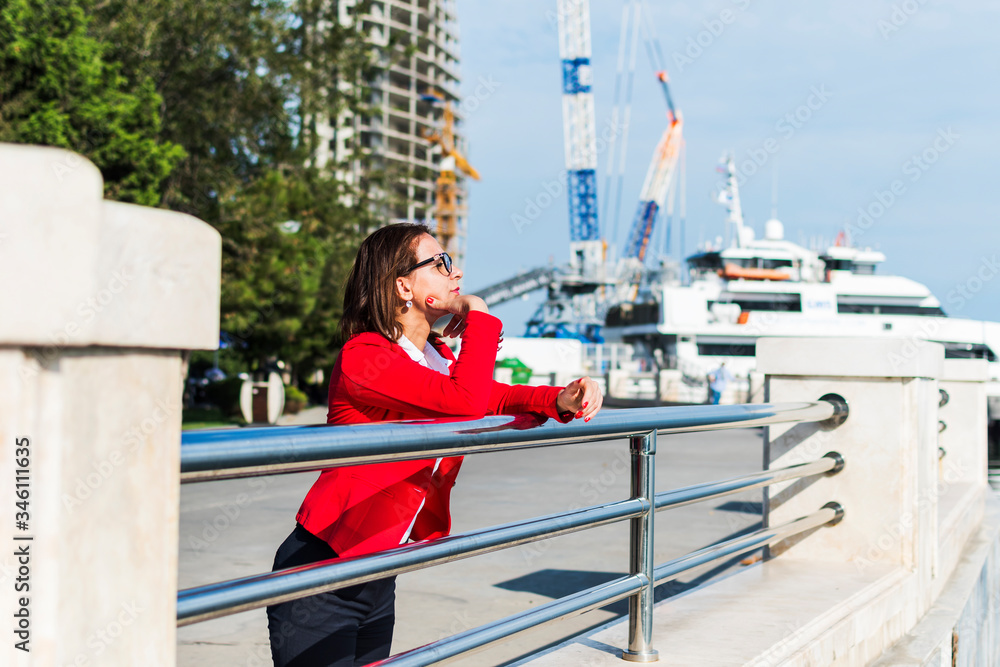 business woman in glasses outdoors looking into the distance business woman in glasses outdoors looking into the distance