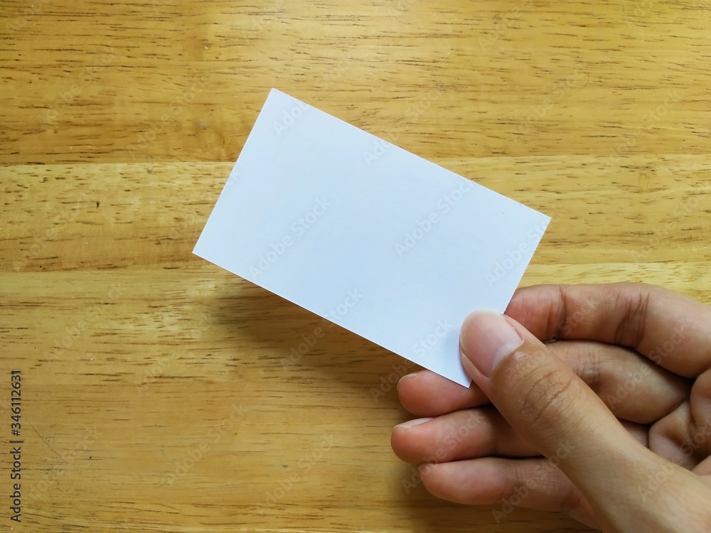 Fototapeta premium hand holding blank business card