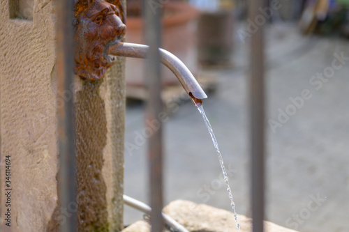 Potable water flowing froma drinking fountain photo