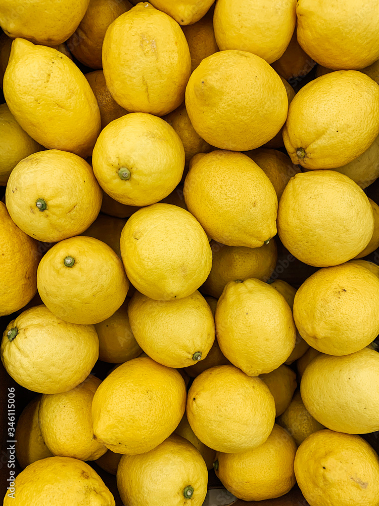 lots of ripe yellow lemon for cooking background