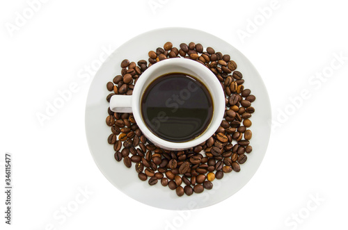 Cup with freshly brewed coffee and grains on a white background. View from above.