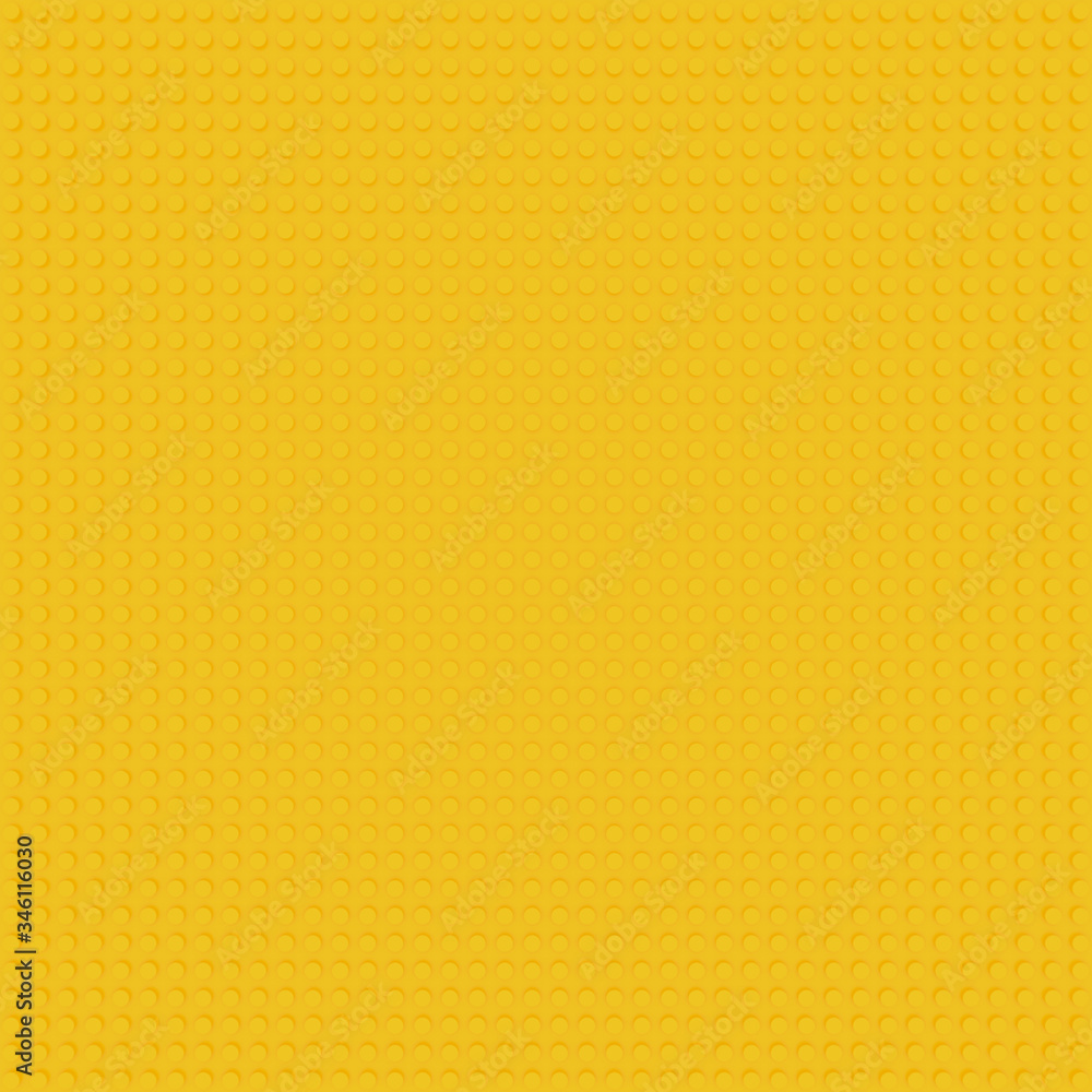 yellow base template of plastic construction brick. Plastic toy blocks background in yellow. Construction plate base for children's toys. Repeating texture and empty field for bricks installation