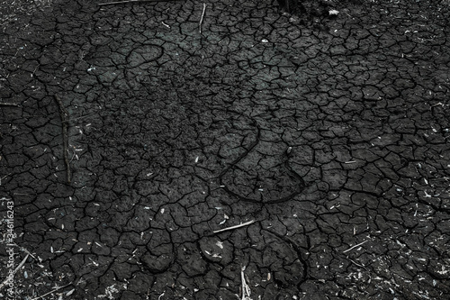 dry black bottom of a drained river