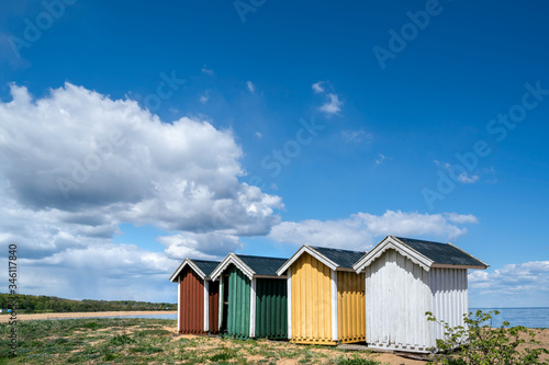 Colourful beach huts in a row on the beach in Simrishamn, Skane, Sweden © Elena Sistaliuk