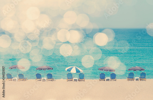 Retro ummer beach with sun umbrellas and sunbeds in. Sunny beach with scenic ...