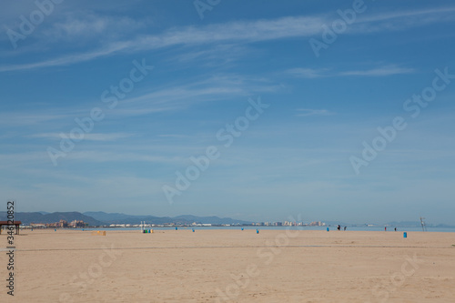 Deserted beaches during siesta and quarantine without people. Blue sky and bright sun and white sand. Valencia, Spain © Ekaterina