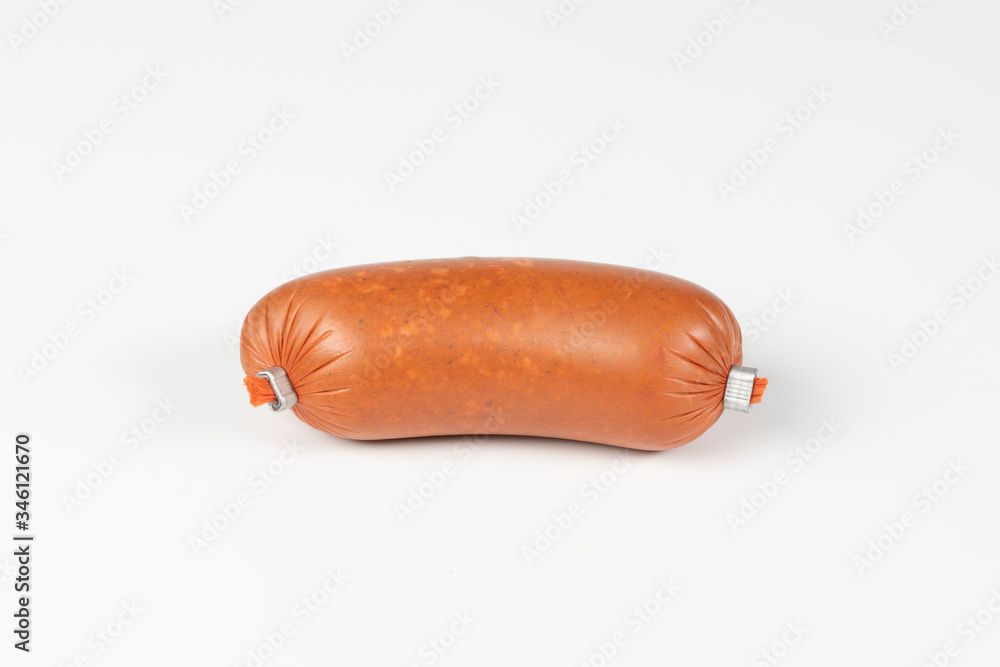 Smoked sausage in plastic shell isolated on white background. Top view Smoked sausage in plastic shell isolated on white background. Top view
