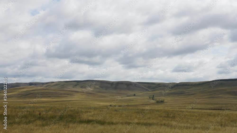 clouds move quickly across the sky. Steppes. Mountains. clouds move quickly across the sky. Steppes. Mountains.