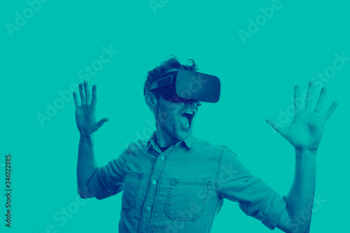 Man in his 30's wearing a VR virtual reality headset. Graphic duotone style