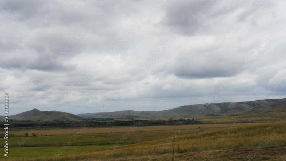 clouds move quickly across the sky. Steppes. Mountains. clouds move quickly across the sky. Steppes. Mountains.