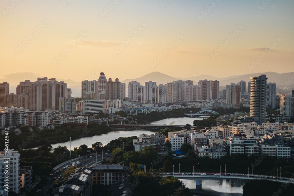 Fototapeta premium Cityscape at sunset in the city of Sanya. Hainan island