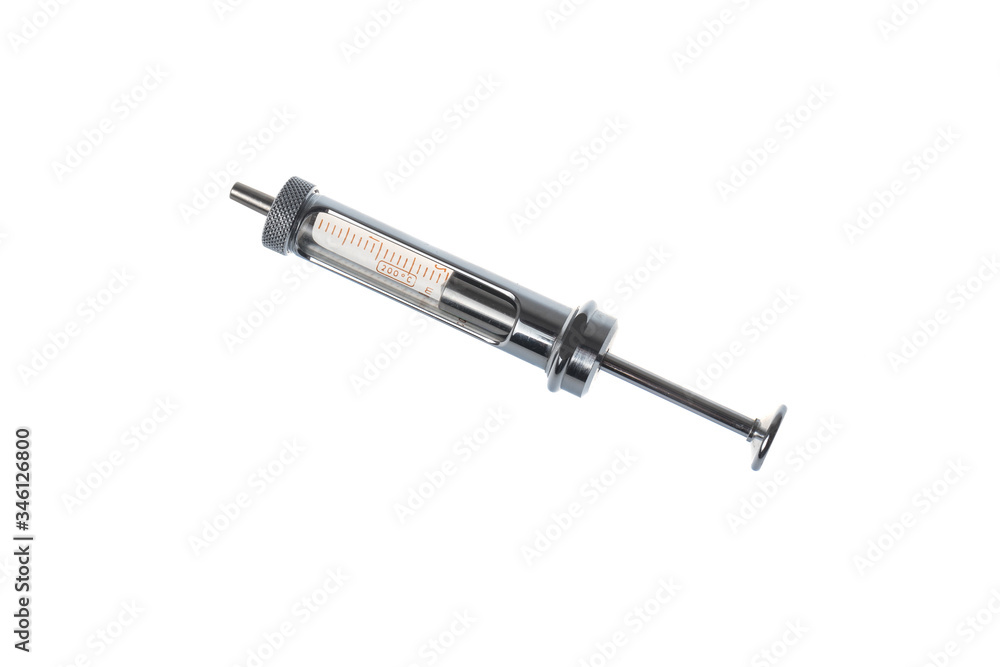 Retro reusable metal syringe for multiple use, opened. Isolated on white background Retro reusable metal syringe for multiple use, opened. Isolated on white background