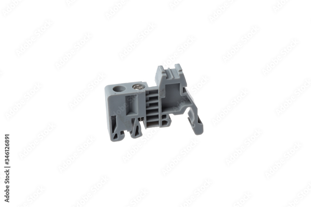 Grey stopper block for electrical terminal for DIN rail, isolated on white background Grey stopper block for electrical terminal for DIN rail, isolated on white background