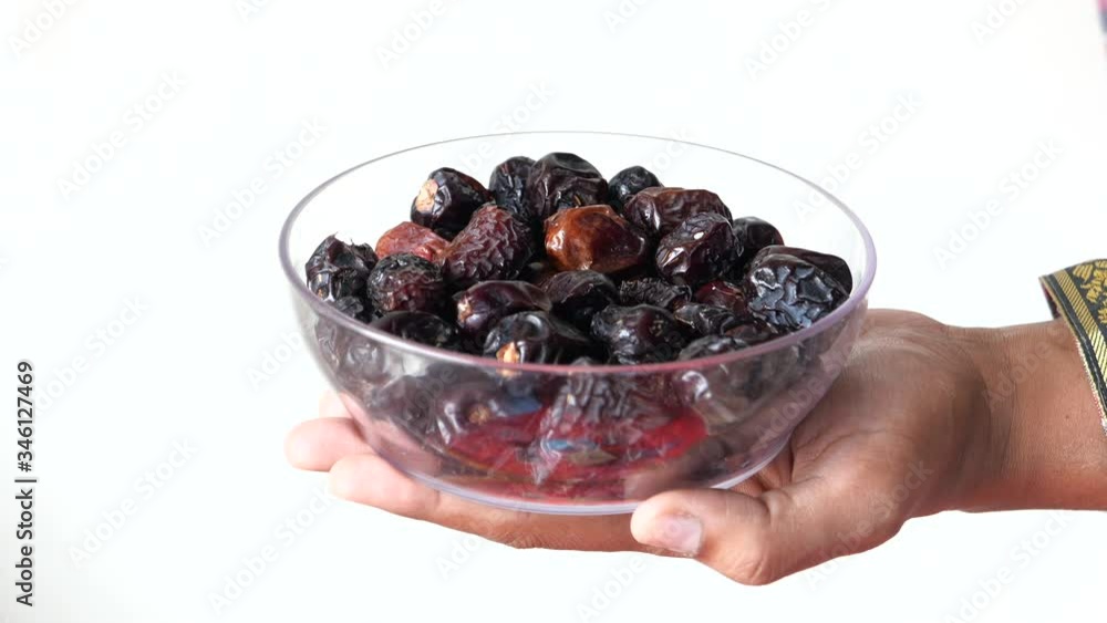 the concept of ramadan, close up of date fruit in a bowl the concept of ramadan, close up of date fruit in a bowl