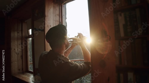 Russia, Moscow - Man at home in quarantine plays music from the windows - flash mob during pandemic of n-cov19 Coronavirus