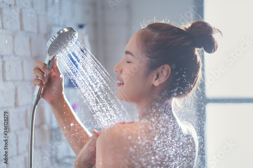 Asian woman enjoying the shower She feels relaxed
