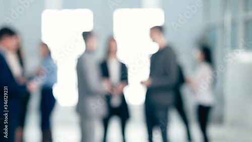 background image of a group of corporate employees in the office lobby