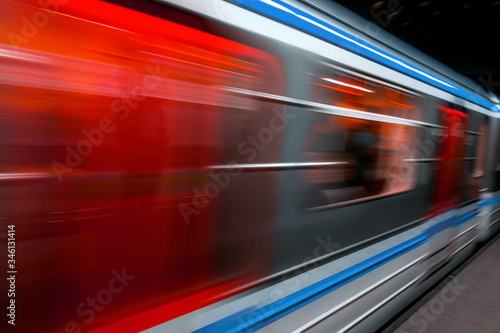 Modern Metro subway Station speed fast Red Blue european public transport for people . Motion speed blur fast moving and arriving time, not late, business Epic trendy cityscape concept . Elevated Road