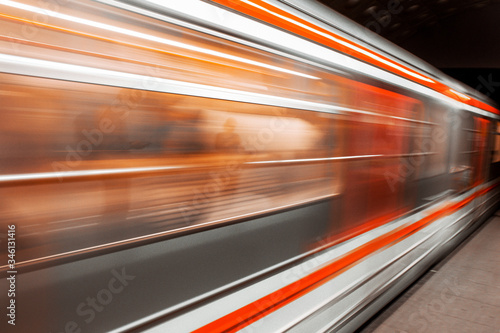 Modern Metro subway Station speed fast Red Blue european public transport for people . Motion speed blur fast moving and arriving time, not late, business Epic trendy cityscape concept . Elevated Road © Andrian