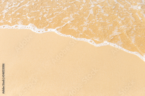 Blank fine sand and white wave, nature background, outdoor day light, summer beach