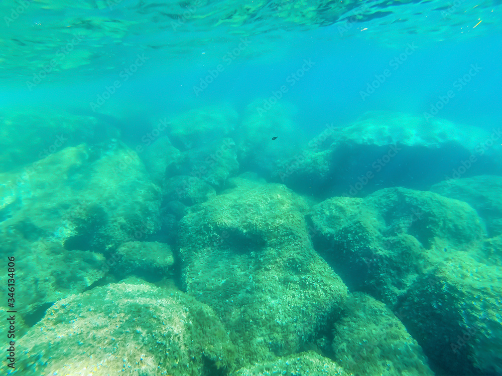Underwater view of Alghero turquoise water in summer
