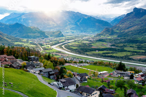 Scenic aerial view of hillside villages in Triesenberg and the river Rhine, natural border of Liechtenstein, an alpine country in central Europe, to Switzerland