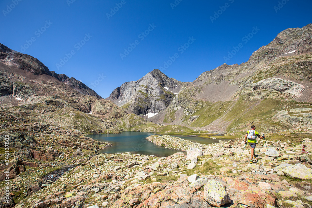A mountaineer at the Ibon de Panticosa in the Pyrenees, Aragon. Spain