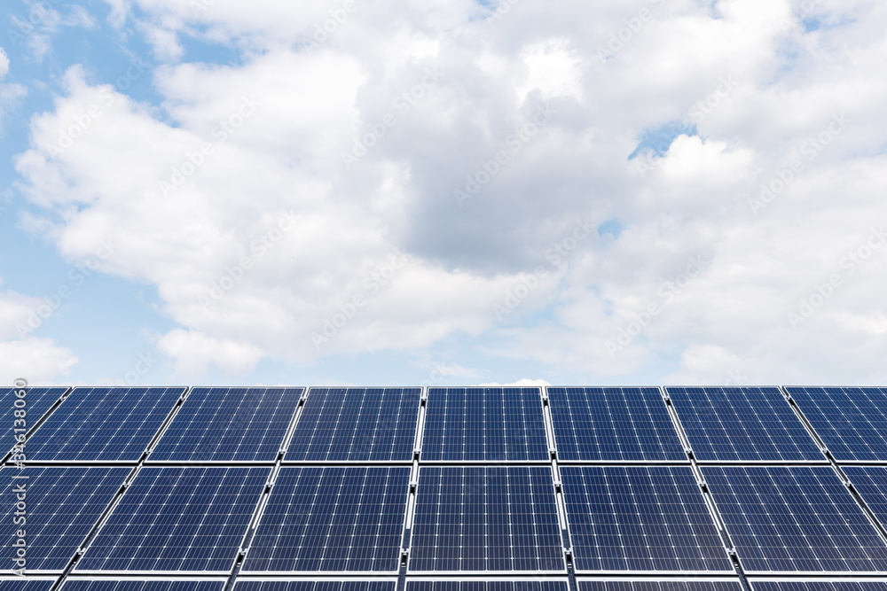 wide view of solar panels on sky background wide view of solar panels on sky background
