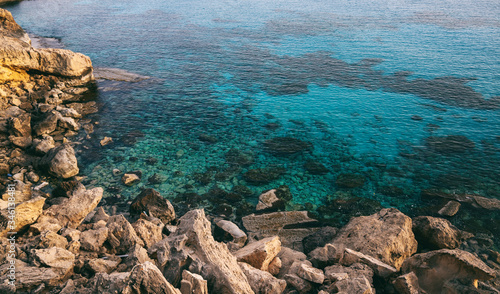 Beautiful sea landscape, bright turquoise water and rocky shore. Mediterranean coast in Cyprus